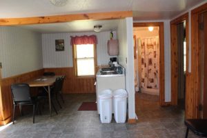 Lakeview Cottage 3 kitchen and 3 seat dining table.